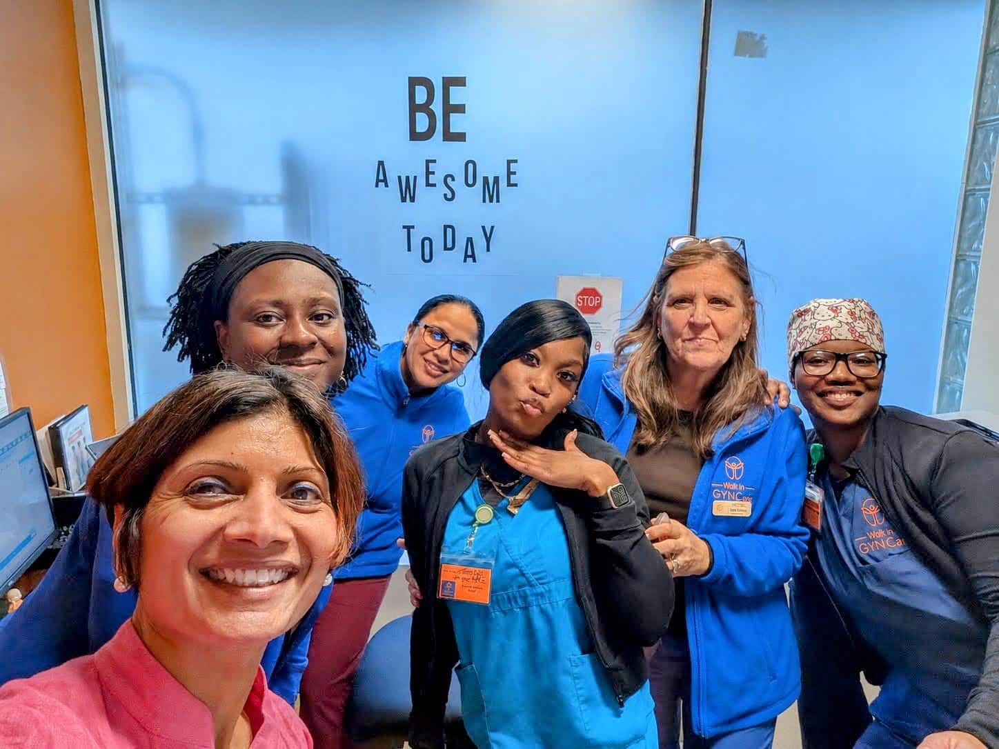 Walk In GYN Care medical team smiling together inside a modern New York women’s health clinic offering same-day gynecology and urgent GYN services.